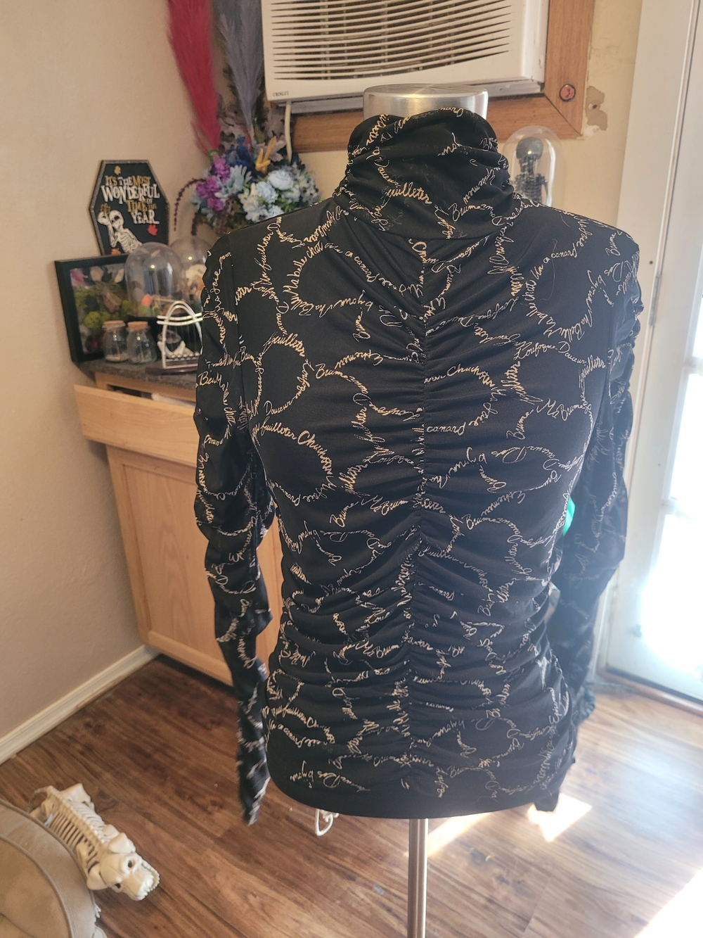 Sweet Rain Black Long-Sleeve Mock Neck Top with Gold Script